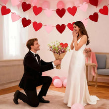 Valentine wedding heart garland banner with red and pink felt hearts overhead
