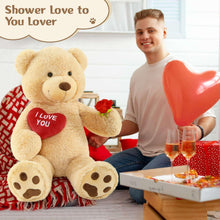 Giant light brown teddy bear plush with red “I Love You” heart