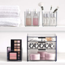 Clear cosmetic organizer set with compartments for bottles, brushes, and small containers