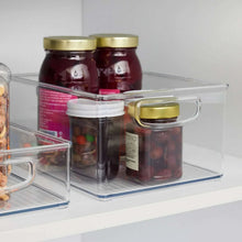 Clear pantry bin with gold-toned lid and side handles