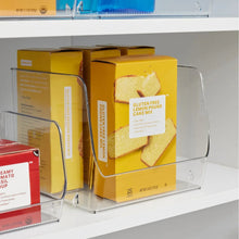 Clear open-front pantry bin holding boxed cake mix, stackable design