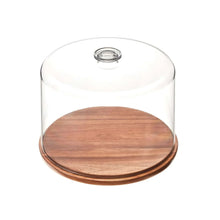 Clear glass dome lid with round wood base for serving