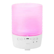 White candle Bluetooth speaker with pink light glow and front control buttons