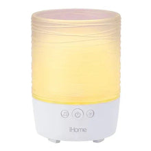 Yellow candle Bluetooth speaker with white base and front control buttons