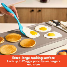 Electric griddle cooking surface with eggs and pancakes, temperature probe on unit
