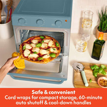 Air fryer toaster oven with open door and pizza cooking inside, Surf blue