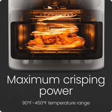 Air fryer basket with food cooking under visible heating elements