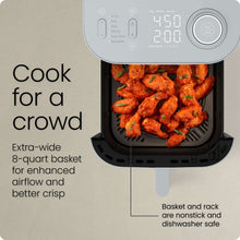 Air fryer control panel with basket open and food inside the basket