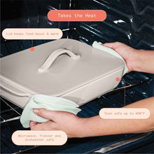 Taupe covered stoneware baking dish on oven rack with lid held by hands