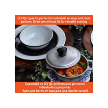 Compact cast aluminum caldero with lid, gray pot with loop handles and black knob.