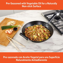 Preseasoned cast iron wok with cool-touch handles on a stovetop