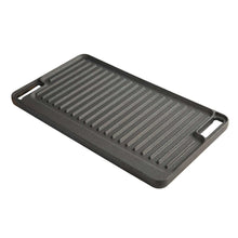 Black cast iron reversible grill griddle plate with raised ridges and side handles