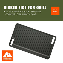 Black cast iron reversible grill griddle plate with ribbed cooking surface and handles