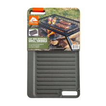 Black cast iron reversible grill griddle plate in retail package, ribbed surface