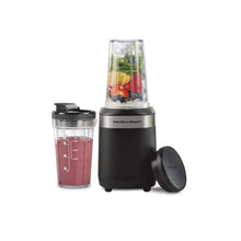 Black single-serve blender with clear blending cup and travel lid