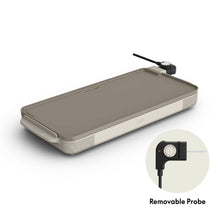 Electric griddle with gray nonstick surface and removable temperature probe, angled view