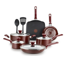 Red nonstick cookware set with matching lids, pans, and utensils