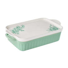 Rectangular mint-green ceramic baker with white platter lid and green floral accents