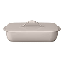 Taupe covered stoneware baking dish with arched lid handle