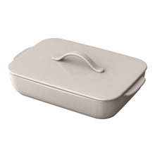 Taupe covered rectangular baking dish with arched lid handle and side grips
