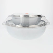 Cast aluminum caldero set with clear glass lids and black knobs, side view.