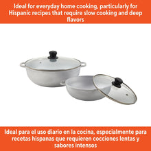 Cast aluminum caldero and smaller pot with glass lids and black knobs.