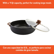 Black speckled ceramic caldero with glass lid and wood-look knob on top
