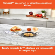 IMUSA 9in round black nonstick comal with metal handles and shallow cooking rim