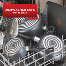 Grey nonstick griddle in dishwasher rack, with handle and side heat spot