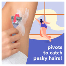 Razor cartridge being used on a leg with shaving gel foam, blue handle