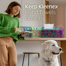 Kleenex Hand Towels box with tissues on a shelf near a person