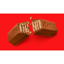 Milk chocolate wafer bars with wafer layers broken open, KitKat branding