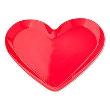 Red heart-shaped platter with glossy finish and raised rim