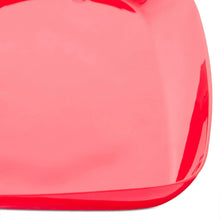 Close-up of glossy red heart platter surface and raised edge