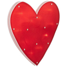 Red heart window silhouette with white border and lit bulb dots across the front