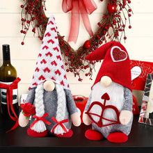 Valentine plush gnome dolls on table, red hat and patterned hat with heart rocking-chair applique