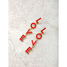 Gold-tone LOVE letter earrings with red L, O, V, E charms laid flat