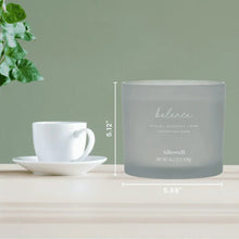 Balance spa jar candle, pale blue jar with label; side view with cup and saucer