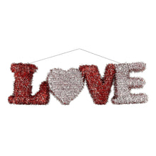 Tinsel hanging decoration shaped like the word “LOVE” in red and silver with a heart