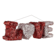 Tinsel hanging decoration word “LOVE” in red and silver, heart-shaped O detail