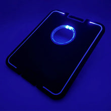 LED cornhole board with blue glowing target ring and corner light bars
