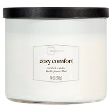 Cozy Comfort scented candle in frosted white jar with black lid, front label view