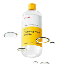 Cleansing water bottle with yellow cap and yellow label, shown with scattered droplets