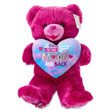 Pink teddy bear plush with pastel heart bib and small side tag