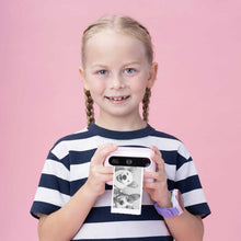myFirst Insta 20 camera held by a child, showing a black-and-white photo print