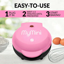 Pink heart waffle maker with hinged lid and black base
