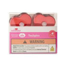Boxed set of red heart-shaped LED tealight candles with warning label