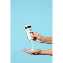 Sunscreen tube dispensing gel onto hand, Ultra Sheer dry-touch SPF 55