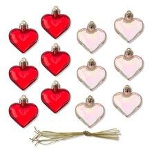 Red and iridescent heart ornaments with gold loops and hanging strings