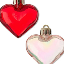 Glossy red and iridescent heart ornaments with gold caps and hanging loops